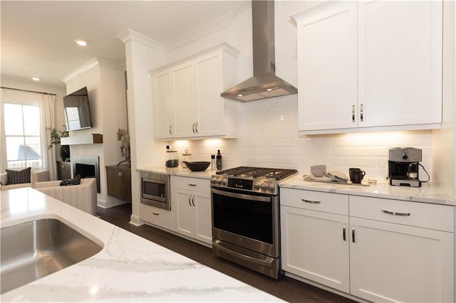 4923 Sudbrook Way Unit 233, Peachtree Corners, GA 30092 - kitchen with wall chimney exhaust hood, appliances with stainless steel finishes, ornamental molding, decorative backsplash, and white cabinets