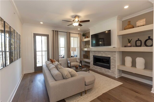 4923 Sudbrook Way Unit 233, Peachtree Corners, GA 30092 - living area with crown molding, a ceiling fan, dark wood-style floors, a glass covered fireplace, and recessed lighting