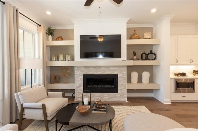 4923 Sudbrook Way Unit 233, Peachtree Corners, GA 30092 - living area featuring a ceiling fan, dark wood-style floors, crown molding, a glass covered fireplace, and recessed lighting