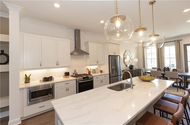 4923 Sudbrook Way Unit 233, Peachtree Corners, GA 30092 - kitchen with appliances with stainless steel finishes, wall chimney exhaust hood, crown molding, recessed lighting, and a breakfast bar
