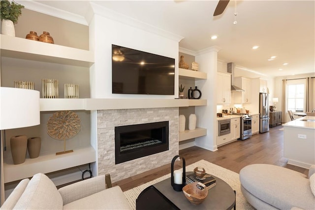 4923 Sudbrook Way Unit 233, Peachtree Corners, GA 30092 - living room with dark wood-style flooring, recessed lighting, ornamental molding, a stone fireplace, and a ceiling fan