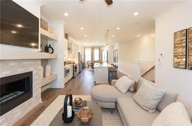 4923 Sudbrook Way Unit 233, Peachtree Corners, GA 30092 - living area with dark wood-type flooring, recessed lighting, ornamental molding, a ceiling fan, and a fireplace