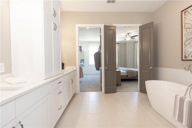 4923 Sudbrook Way Unit 233, Peachtree Corners, GA 30092 - ensuite bathroom with a freestanding tub, a ceiling fan, and vanity