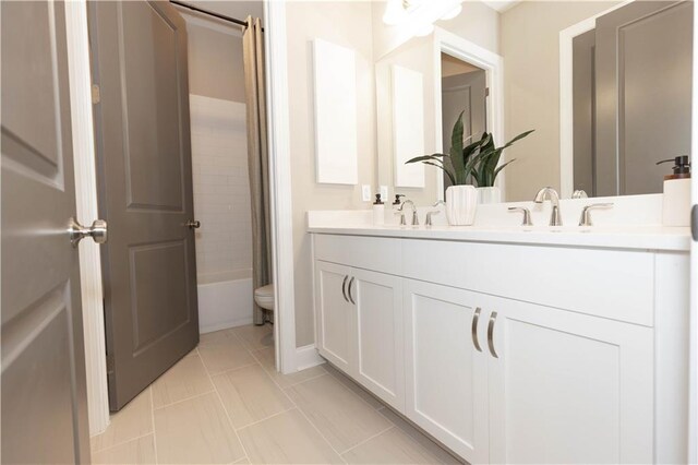 4923 Sudbrook Way Unit 233, Peachtree Corners, GA 30092 - full bathroom featuring double vanity, shower / bath combo with shower curtain, and tile patterned floors