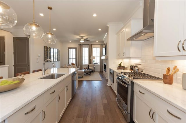 4923 Sudbrook Way Unit 233, Peachtree Corners, GA 30092 - kitchen featuring wall chimney exhaust hood, stainless steel appliances, open floor plan, white cabinets, and ornamental molding