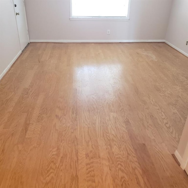 unfurnished room with light hardwood / wood-style flooring