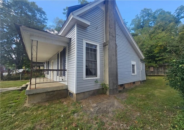 view of home's exterior featuring a yard