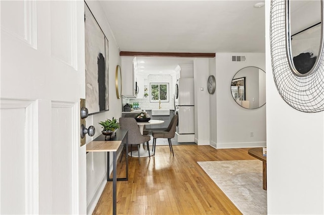 foyer entrance featuring light hardwood / wood-style flooring