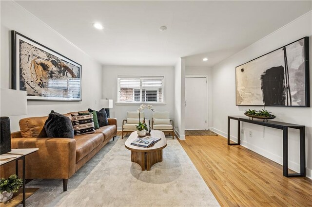 living room with sink and light hardwood / wood-style flooring