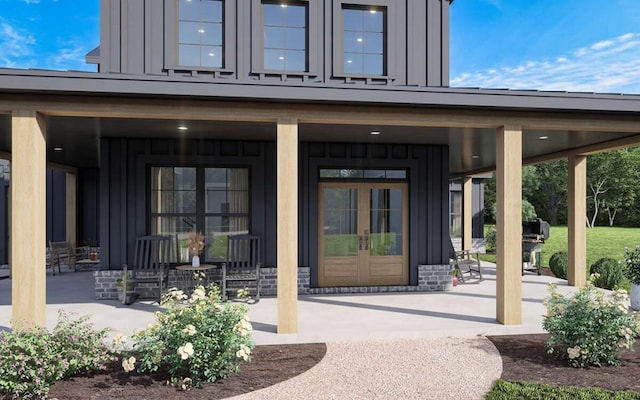 doorway to property with french doors and board and batten siding