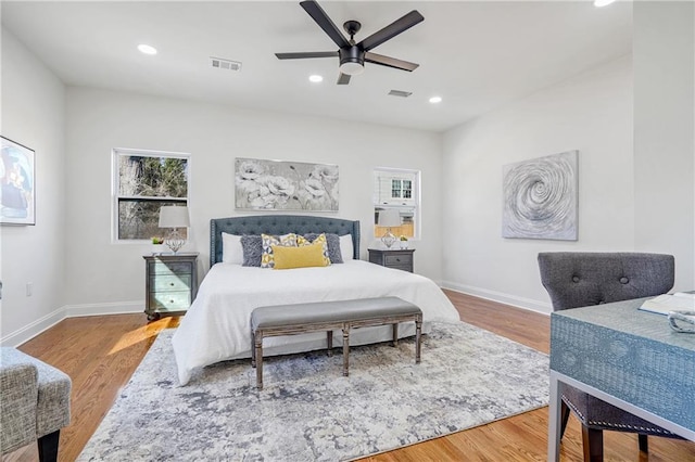 bedroom with ceiling fan and hardwood / wood-style floors