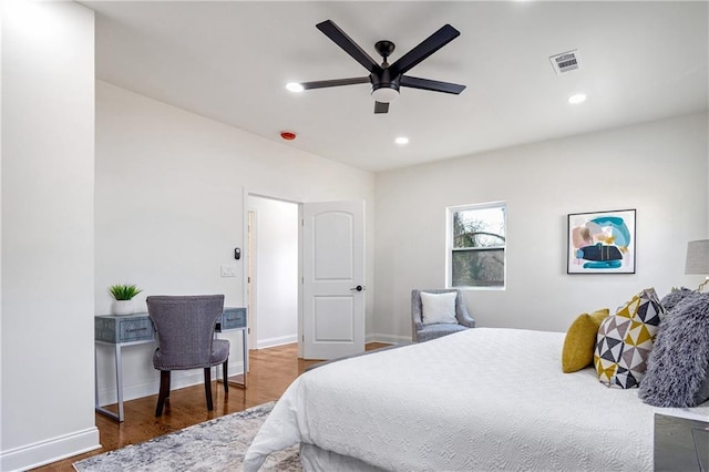 bedroom featuring ceiling fan and dark hardwood / wood-style floors