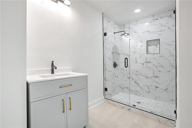 bathroom with an enclosed shower and vanity