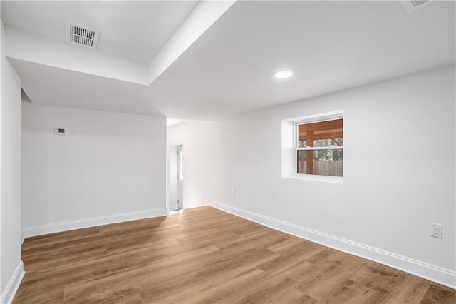 spare room featuring hardwood / wood-style floors