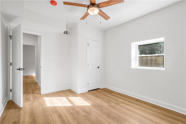 unfurnished bedroom with ceiling fan and light hardwood / wood-style flooring