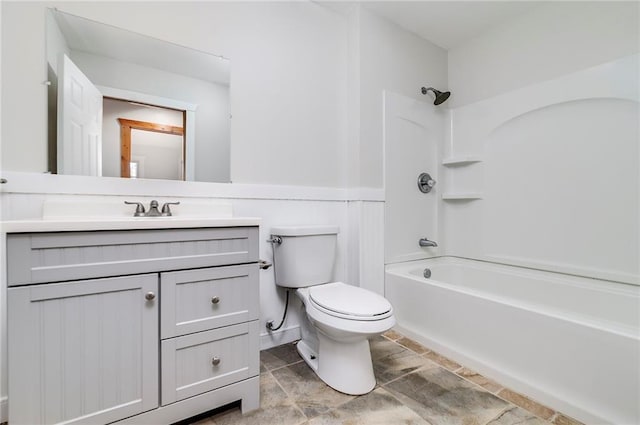 full bathroom with shower / washtub combination, vanity, and toilet