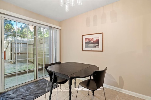 dining space featuring light tile patterned flooring