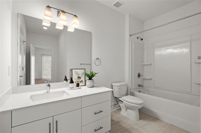 full bathroom featuring visible vents, tub / shower combination, toilet, and vanity