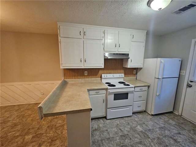 kitchen with a textured ceiling, white cabinets, white appliances, and kitchen peninsula