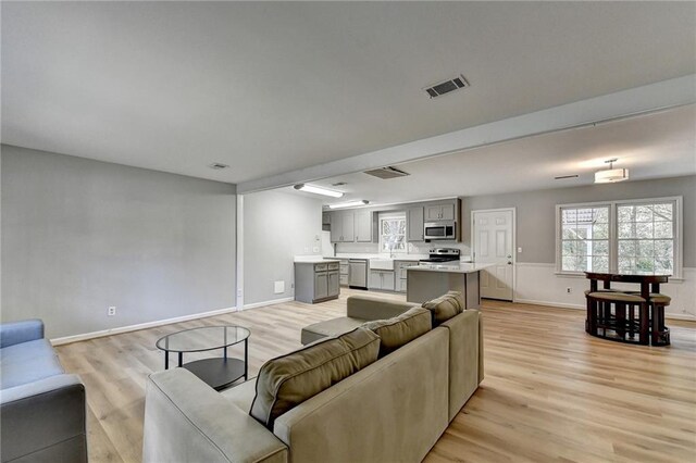 living room with light hardwood / wood-style flooring