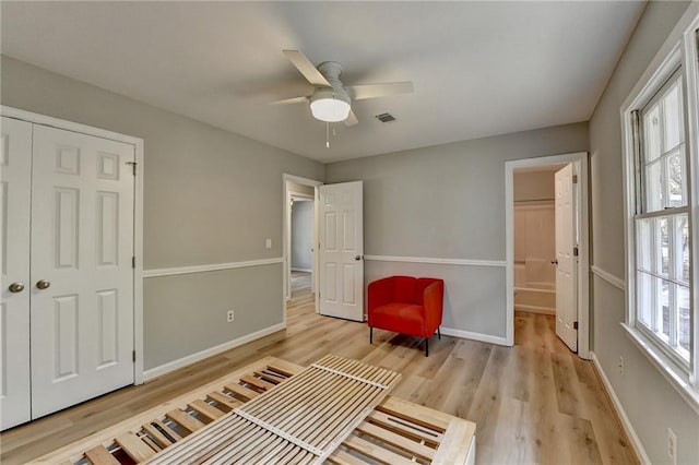 sitting room featuring ceiling fan and light wood-type flooring