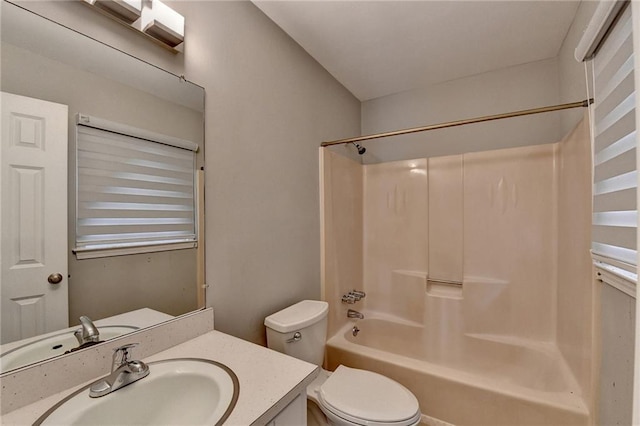 full bathroom featuring vanity, bathtub / shower combination, and toilet