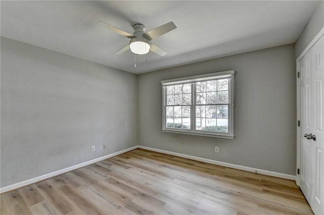 unfurnished room featuring ceiling fan and light wood-type flooring