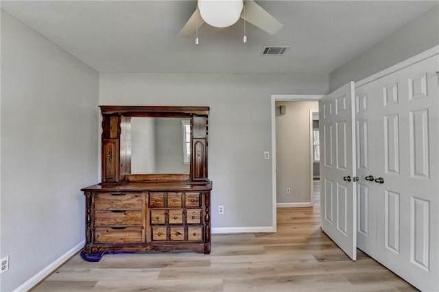 bedroom with ceiling fan and light hardwood / wood-style floors