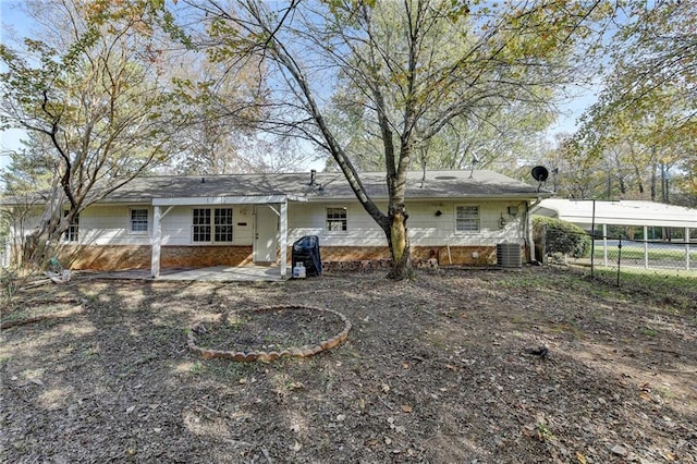 back of property featuring cooling unit