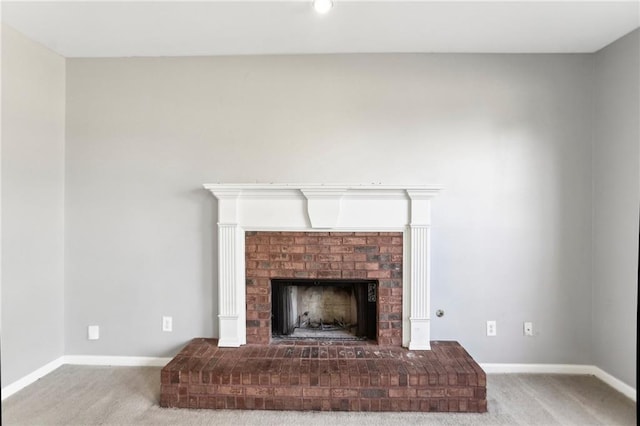 interior details featuring carpet flooring, baseboards, and a fireplace