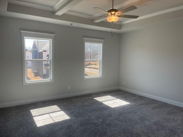 carpeted spare room featuring baseboards, a tray ceiling, and ceiling fan