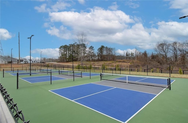 view of tennis court with fence