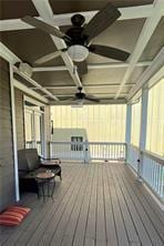 wooden deck featuring ceiling fan