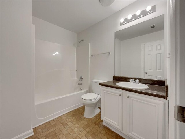 full bathroom with toilet, vanity, and bathing tub / shower combination