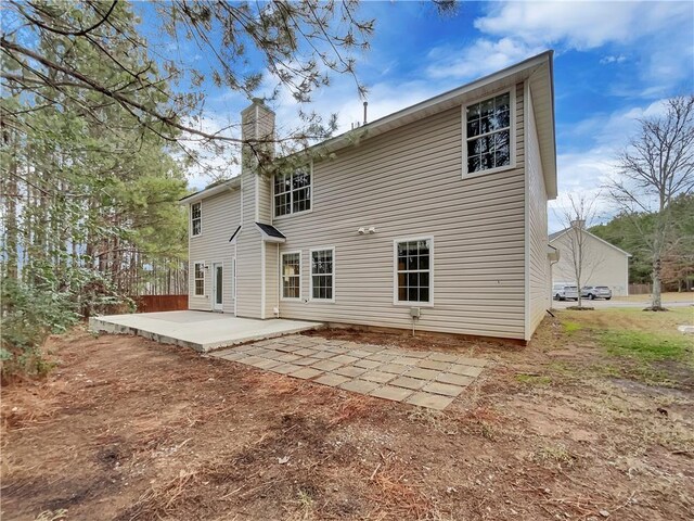 rear view of property featuring a patio