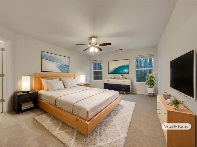 carpeted bedroom featuring ceiling fan