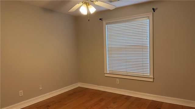 unfurnished room with ceiling fan and hardwood / wood-style flooring