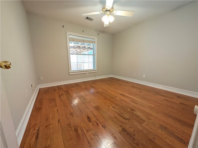 spare room featuring ceiling fan and wood-type flooring