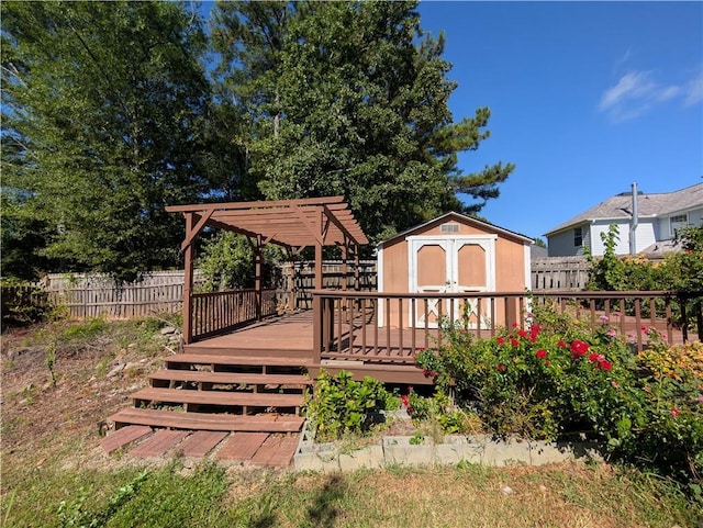 wooden terrace with a pergola and a storage shed