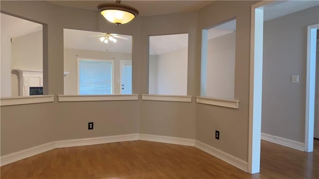 spare room with ceiling fan and hardwood / wood-style floors