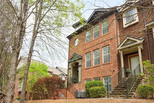 view of front facade featuring central AC