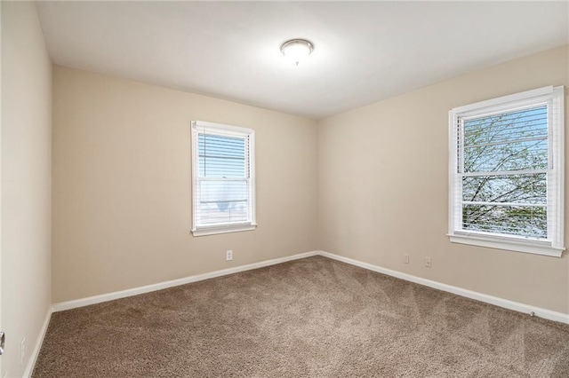 unfurnished room with carpet flooring