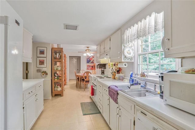 850 John Alden Rd, Stone Mountain, GA 30083 - kitchen with a sink, white appliances, light countertops, and ceiling fan