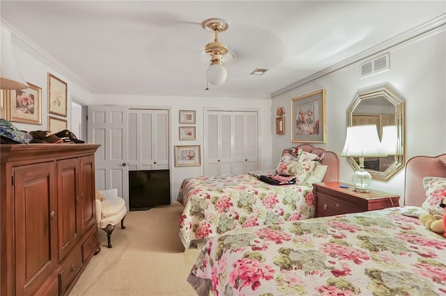 850 John Alden Rd, Stone Mountain, GA 30083 - bedroom with light carpet, multiple closets, ornamental molding, and ceiling fan