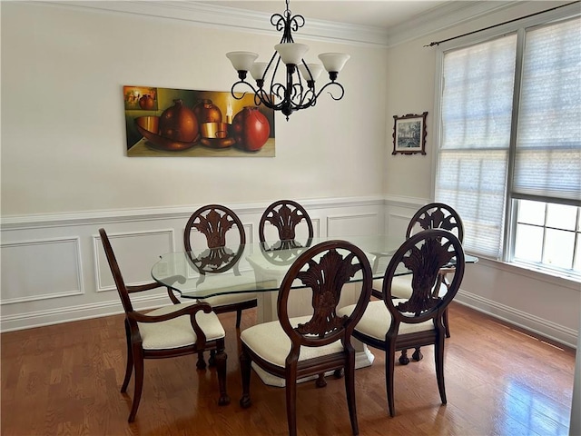 1055 Havenstone Walk, Lawrenceville, GA 30045 - dining room with a chandelier, ornamental molding, a decorative wall, a wainscoted wall, and wood finished floors