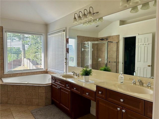 1055 Havenstone Walk, Lawrenceville, GA 30045 - bathroom featuring lofted ceiling, tile patterned flooring, healthy amount of natural light, a stall shower, and double vanity