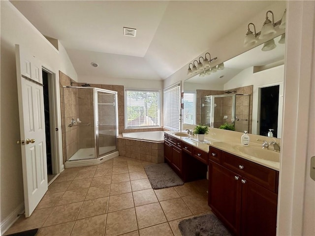 1055 Havenstone Walk, Lawrenceville, GA 30045 - full bath with tile patterned flooring, lofted ceiling, a bath, a shower stall, and double vanity