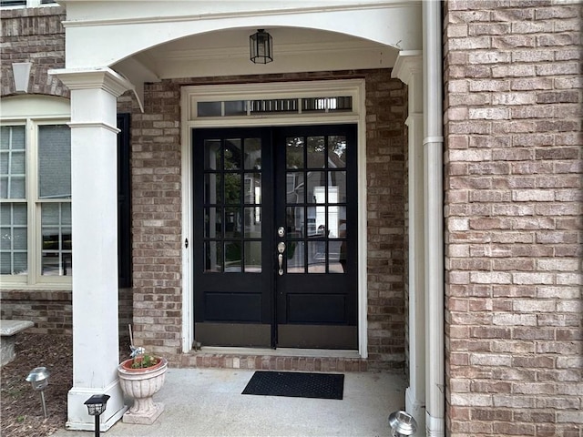 1055 Havenstone Walk, Lawrenceville, GA 30045 - doorway to property featuring french doors and brick siding