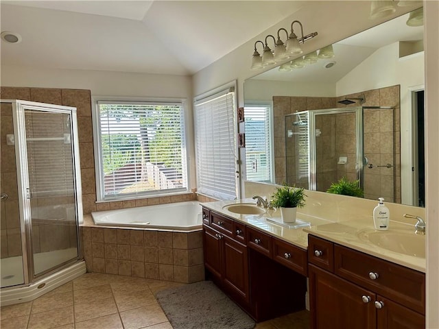 1055 Havenstone Walk, Lawrenceville, GA 30045 - full bathroom featuring lofted ceiling, healthy amount of natural light, tile patterned flooring, double vanity, and a stall shower