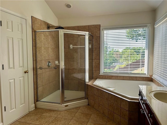 1055 Havenstone Walk, Lawrenceville, GA 30045 - full bath featuring a garden tub, a stall shower, tile patterned floors, vanity, and vaulted ceiling